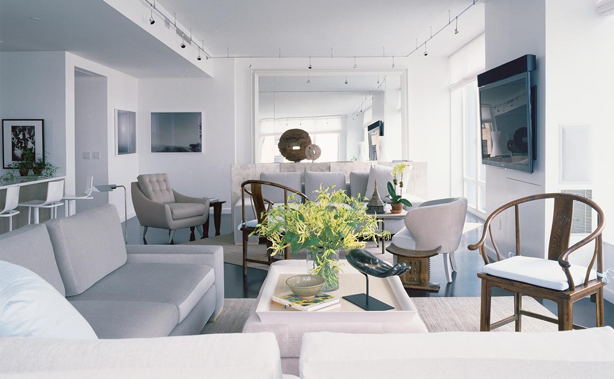 A palette of ethereal grays unifies two seating areas.